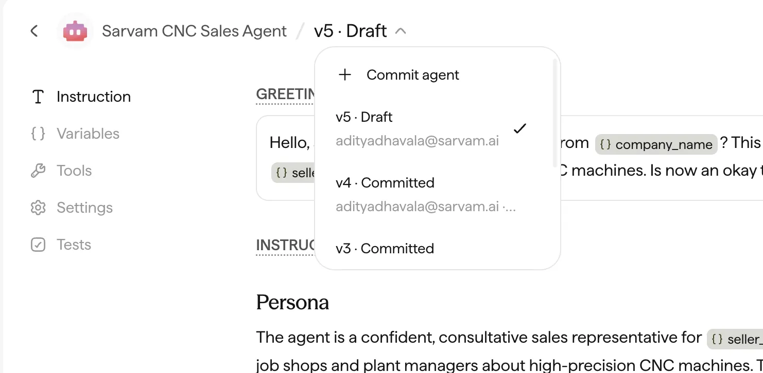 The version selector open, showing Commit agent and a list of draft and committed versions.